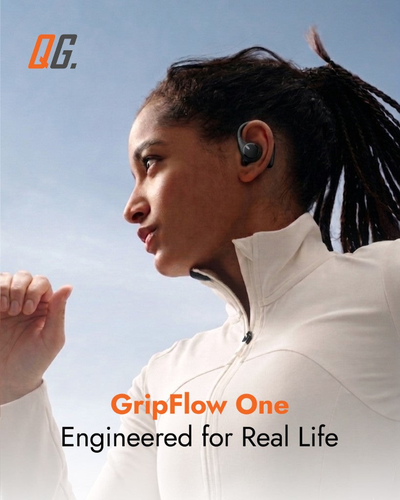 A runner moving through the city wearing GripFlow One, both ears open to traffic